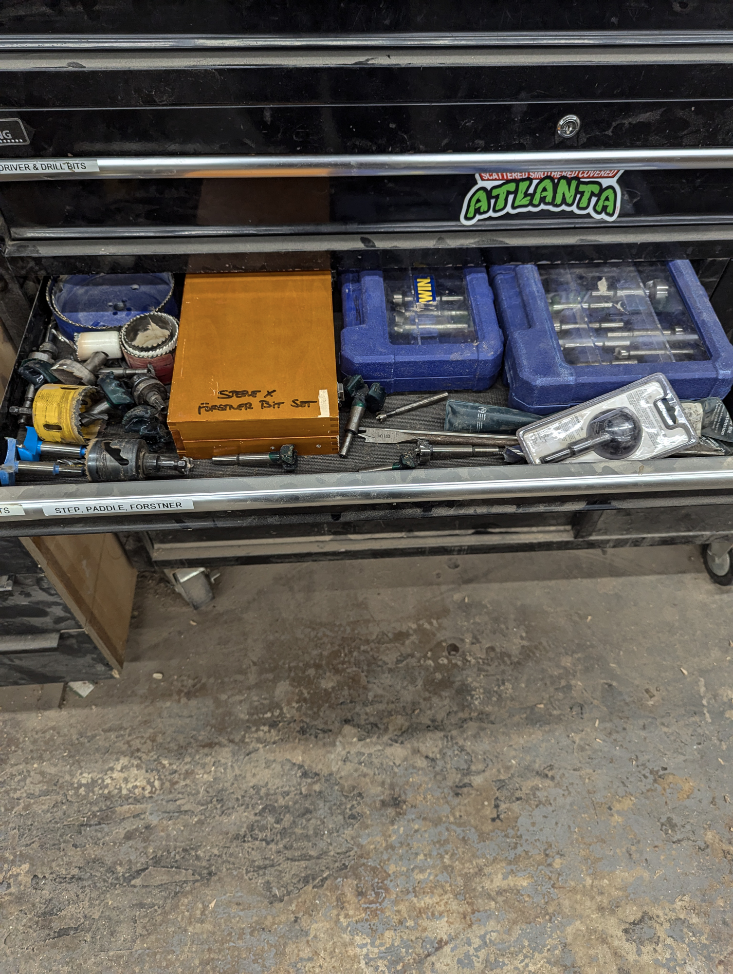 Cluttered workshop storage before organizing — East Point
