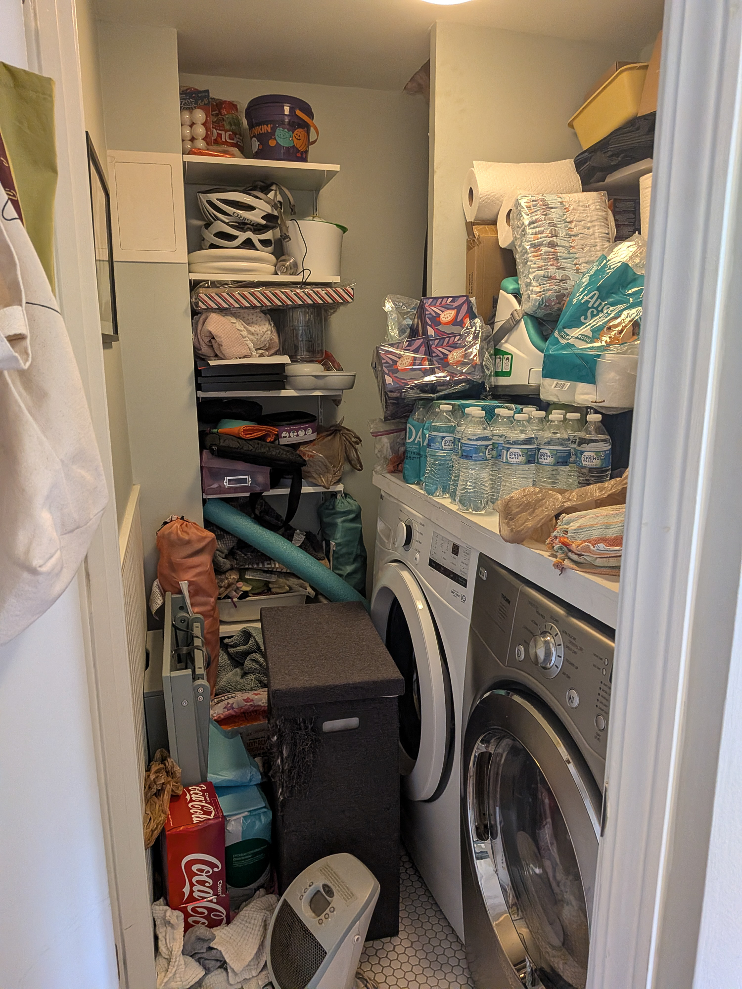 Cluttered laundry room in Poncey Highlands, Atlanta — before organizing